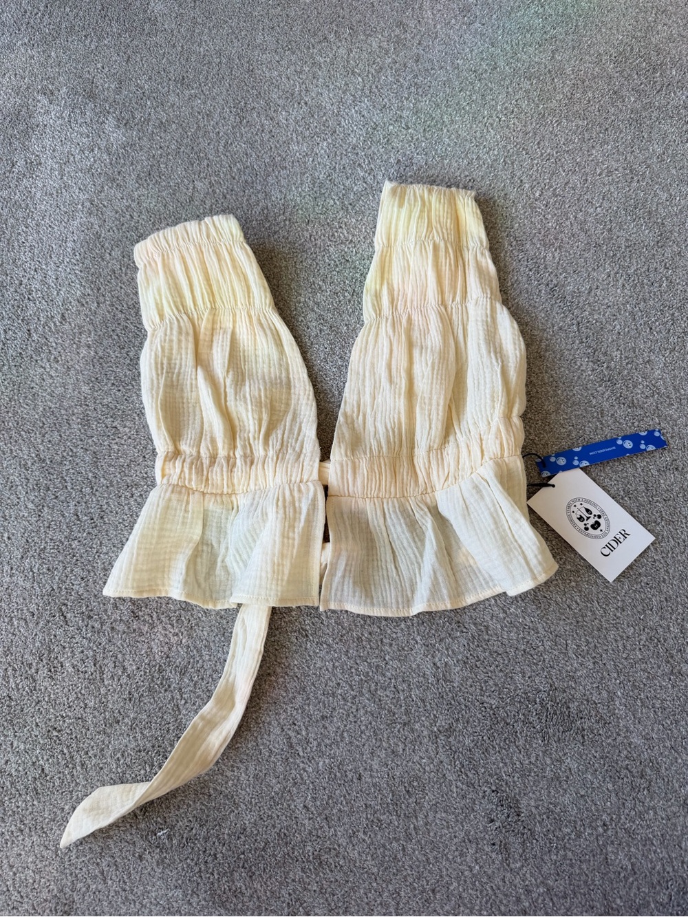 Cider Smocked Peplum Tie-Back Crop Top in Soft Butter